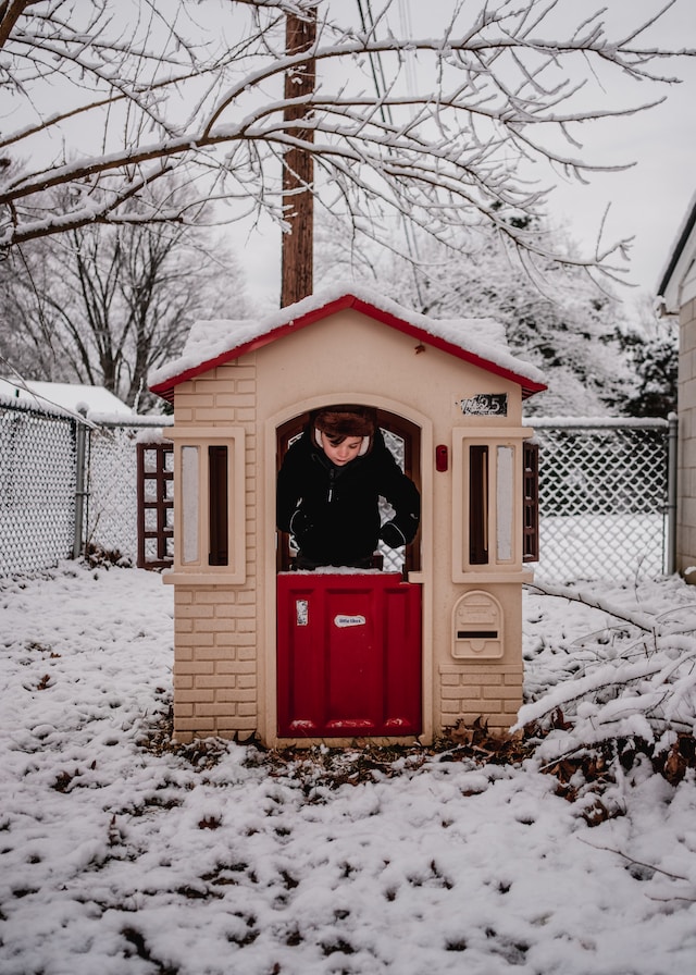 Playhouse with child in it.