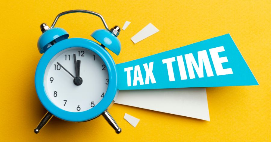 Picture of a clock with words Tax Time