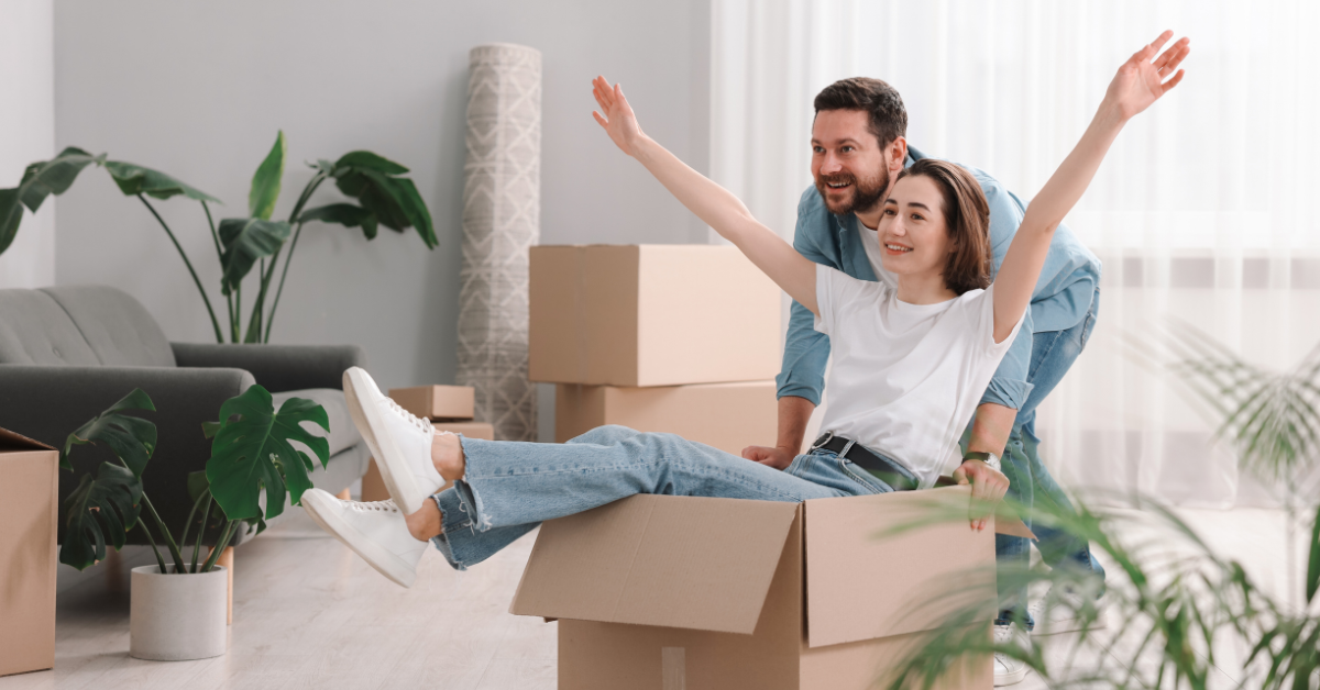 Young couple with moving boxes