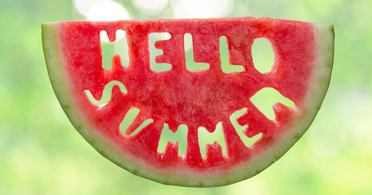 A watermelon with the words cut out "Hello Summer"