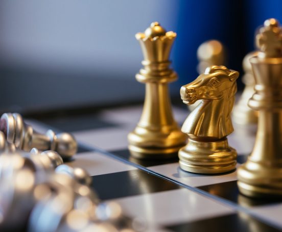 Close-up of chess pieces on a chessboard