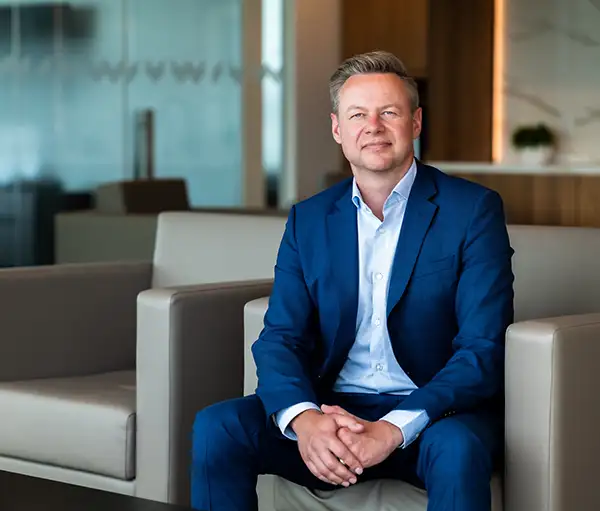 Darren Morcom sitting in a chair