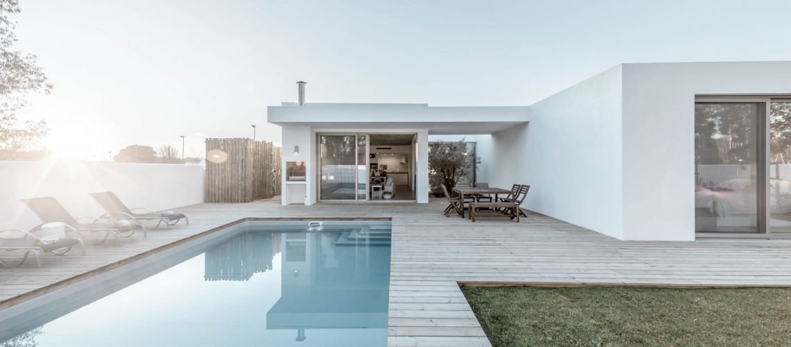 modern-house-with-garden-swimming-pool-and-wooden-PFH8GAV-scaled-1