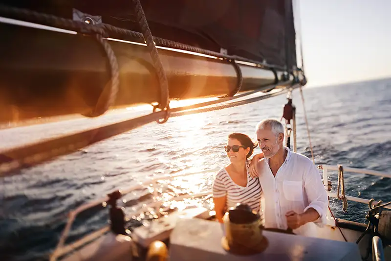middle aged couple on a sail boat