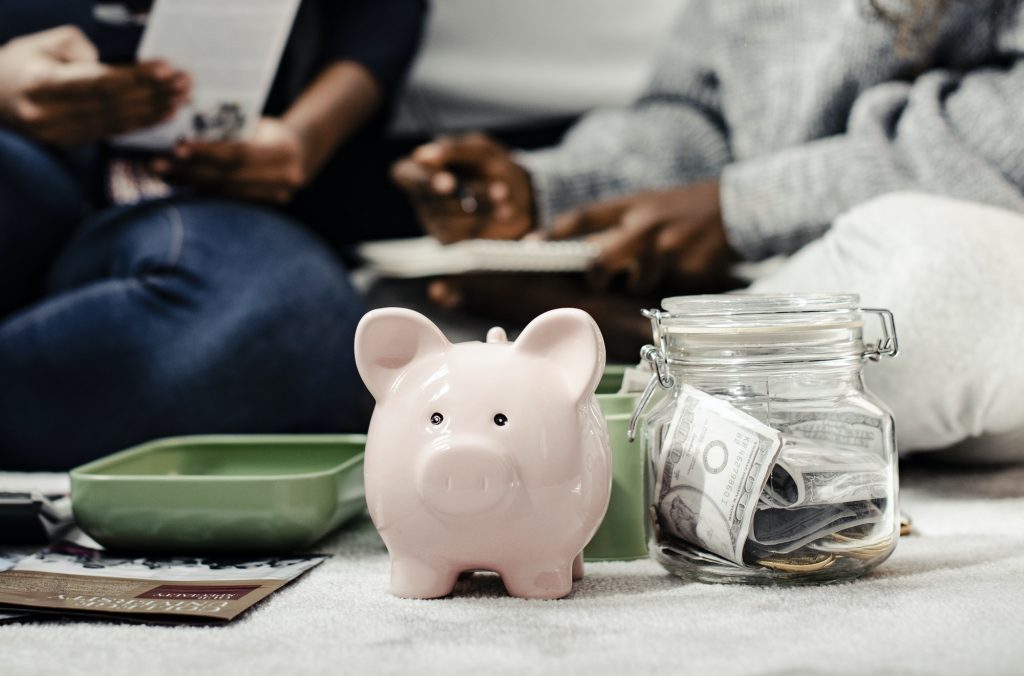 Mother teaching her daughter about savings