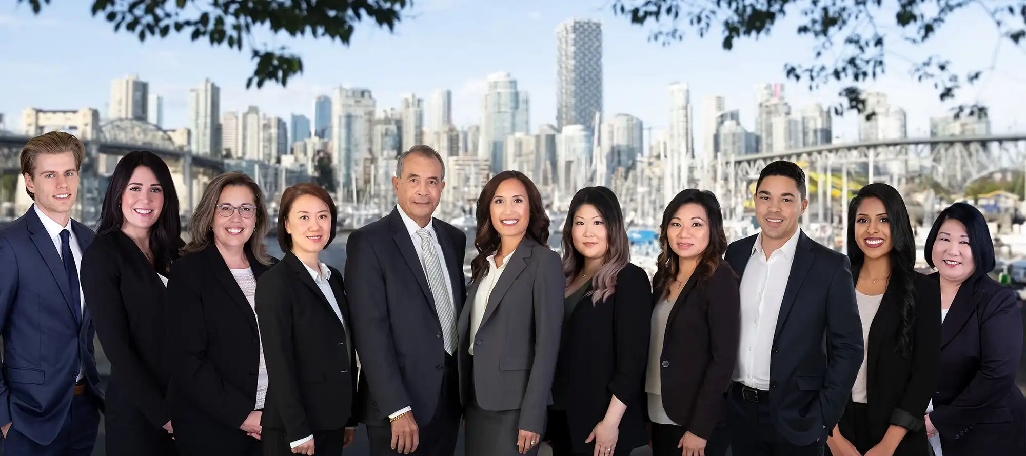 The Wong Group team photo on a cityscape